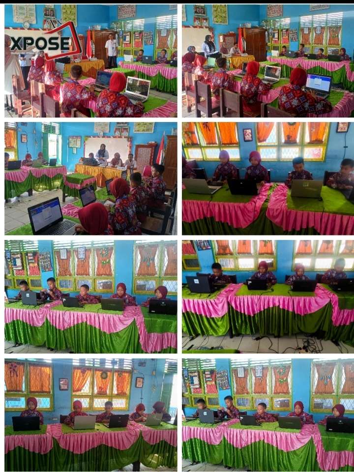 Di dalam ruang ujian, para siswa terlihat fokus mengerjakan soal-soal di laptop masing-masing,